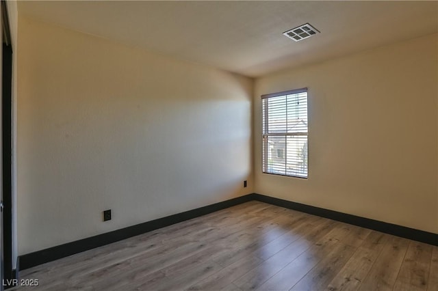 235 Calvino Ave, Las Vegas, NV 89183 - unfurnished room featuring wood finished floors and baseboards
