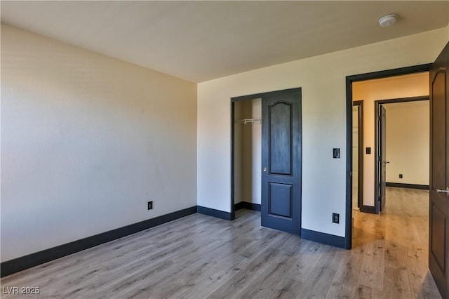 235 Calvino Ave, Las Vegas, NV 89183 - unfurnished bedroom featuring wood finished floors and a closet