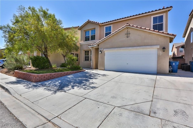 235 Calvino Ave, Las Vegas, NV 89183 - mediterranean / spanish-style home featuring driveway, a garage, stucco siding, and a tile roof