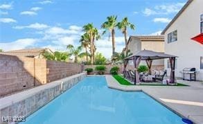 11018 Salernes St, Las Vegas, NV 89141 - view of swimming pool with a patio, a fenced backyard, and a gazebo