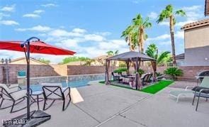 11018 Salernes St, Las Vegas, NV 89141 - fenced backyard with a gazebo, a patio, and an outdoor pool