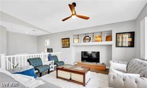 11018 Salernes St, Las Vegas, NV 89141 - living room featuring ceiling fan and lofted ceiling
