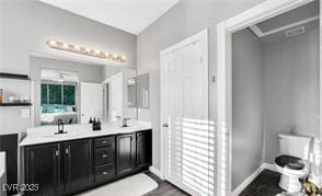 11018 Salernes St, Las Vegas, NV 89141 - bathroom featuring double vanity and wood finished floors