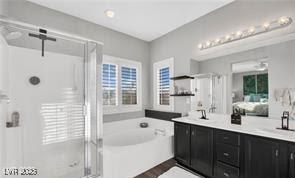 11018 Salernes St, Las Vegas, NV 89141 - full bath with a garden tub, double vanity, a stall shower, and healthy amount of natural light