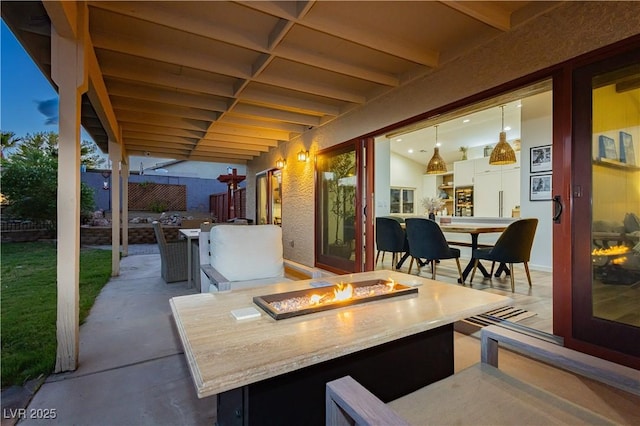 3227 Paintedhills Ave, Las Vegas, NV 89120 - view of patio with a fire pit and outdoor dining area