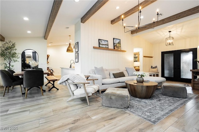 3227 Paintedhills Ave, Las Vegas, NV 89120 - living area featuring french doors, beam ceiling, wood finished floors, a chandelier, and recessed lighting