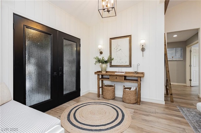 3227 Paintedhills Ave, Las Vegas, NV 89120 - foyer entrance featuring french doors, light wood-type flooring, and a chandelier