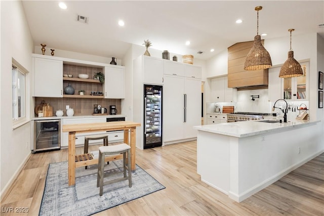 3227 Paintedhills Ave, Las Vegas, NV 89120 - kitchen with beverage cooler, decorative backsplash, white cabinetry, lofted ceiling, and recessed lighting