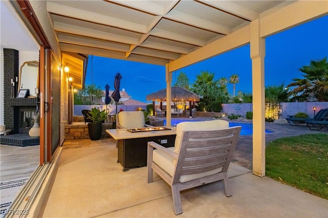 3227 Paintedhills Ave, Las Vegas, NV 89120 - patio at night with a gazebo, a fire pit, a patio area, and a fenced backyard