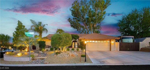 3227 Paintedhills Ave, Las Vegas, NV 89120 - mediterranean / spanish-style house with driveway, a tile roof, a garage, and stucco siding