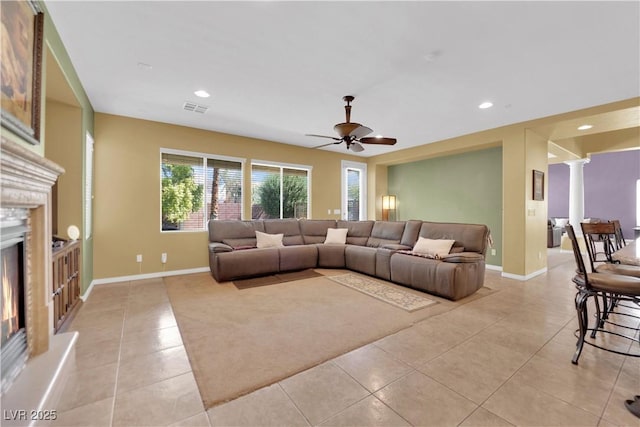 9516 Bluff Ledge Ave, Las Vegas, NV 89149 - living area featuring light tile patterned flooring, ceiling fan, a glass covered fireplace, and recessed lighting