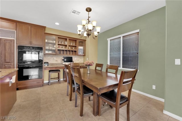 9516 Bluff Ledge Ave, Las Vegas, NV 89149 - dining room featuring a chandelier, light tile patterned floors, and recessed lighting