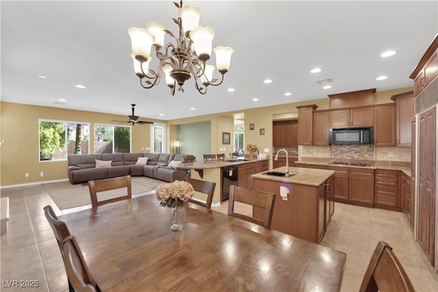 9516 Bluff Ledge Ave, Las Vegas, NV 89149 - dining area with light tile patterned flooring, recessed lighting, a chandelier, and ceiling fan