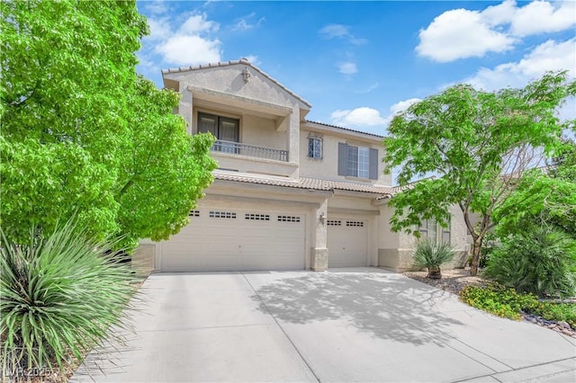 9516 Bluff Ledge Ave, Las Vegas, NV 89149 - view of front of home featuring stucco siding, a tiled roof, a balcony, driveway, and an attached garage
