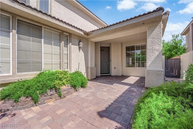 9516 Bluff Ledge Ave, Las Vegas, NV 89149 - property entrance with stucco siding and a patio area