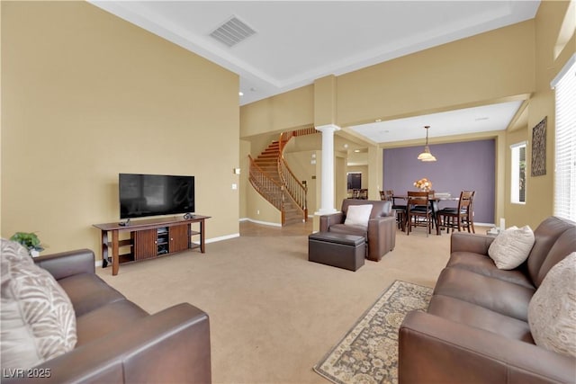 9516 Bluff Ledge Ave, Las Vegas, NV 89149 - living room featuring stairway, decorative columns, and carpet flooring