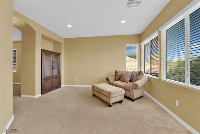 9516 Bluff Ledge Ave, Las Vegas, NV 89149 - living area featuring light colored carpet, recessed lighting, and arched walkways