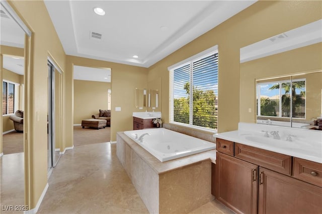 9516 Bluff Ledge Ave, Las Vegas, NV 89149 - bathroom with plenty of natural light, two vanities, a bath, and recessed lighting