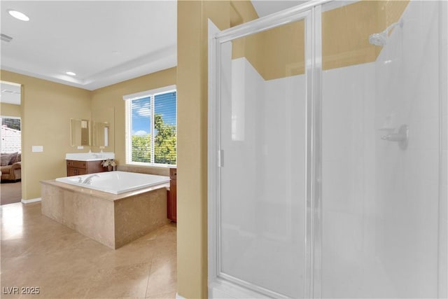 9516 Bluff Ledge Ave, Las Vegas, NV 89149 - ensuite bathroom featuring a stall shower, vanity, tile patterned floors, recessed lighting, and a garden tub