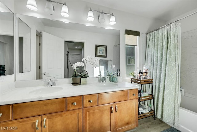 10167 Bishops Peak Ct, Las Vegas, NV 89141 - full bathroom featuring double vanity, wood finished floors, and shower / bath combo with shower curtain