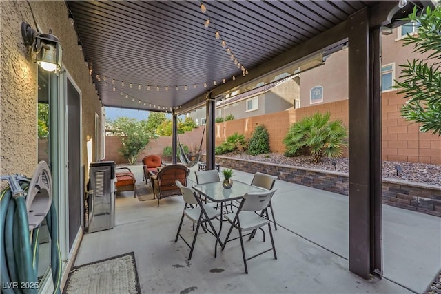 10167 Bishops Peak Ct, Las Vegas, NV 89141 - fenced backyard featuring a patio and outdoor dining area