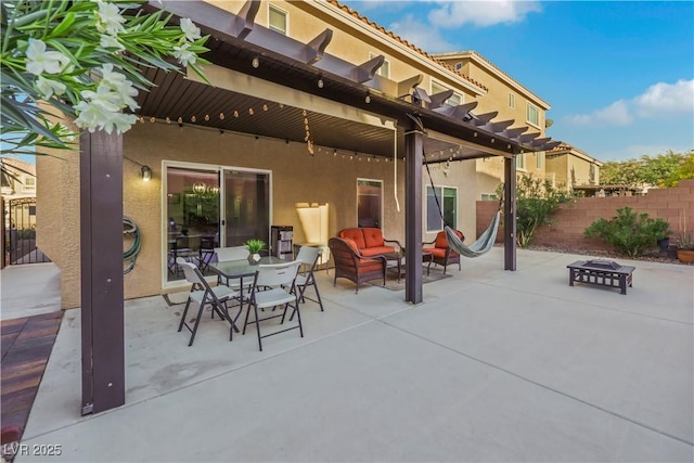 10167 Bishops Peak Ct, Las Vegas, NV 89141 - view of patio with a pergola, outdoor dining space, and an outdoor living space with a fire pit