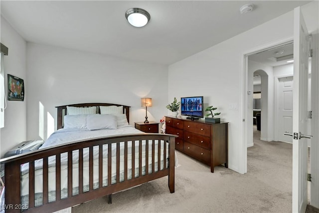 10167 Bishops Peak Ct, Las Vegas, NV 89141 - bedroom featuring light colored carpet and arched walkways
