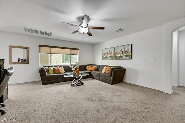 10167 Bishops Peak Ct, Las Vegas, NV 89141 - carpeted living room featuring arched walkways and a ceiling fan