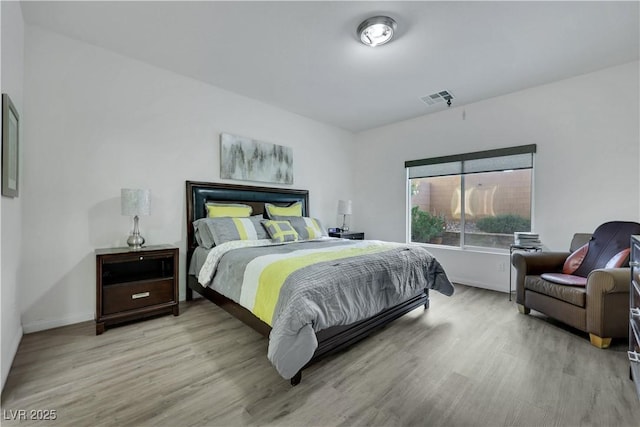 10167 Bishops Peak Ct, Las Vegas, NV 89141 - bedroom featuring light wood-style flooring and baseboards