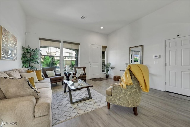 10167 Bishops Peak Ct, Las Vegas, NV 89141 - living area featuring plenty of natural light, light wood-style floors, recessed lighting, and a towering ceiling