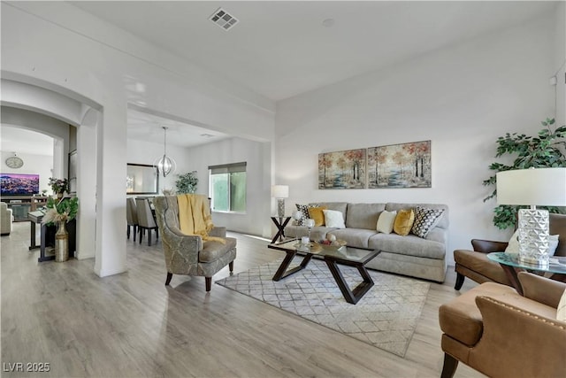10167 Bishops Peak Ct, Las Vegas, NV 89141 - living area with wood finished floors and arched walkways