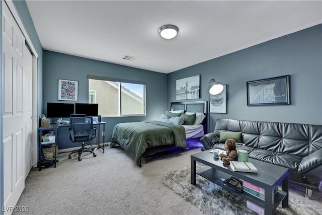 10167 Bishops Peak Ct, Las Vegas, NV 89141 - carpeted bedroom with a desk and a closet