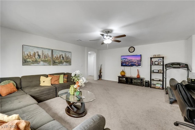 10167 Bishops Peak Ct, Las Vegas, NV 89141 - carpeted living area with a ceiling fan and arched walkways