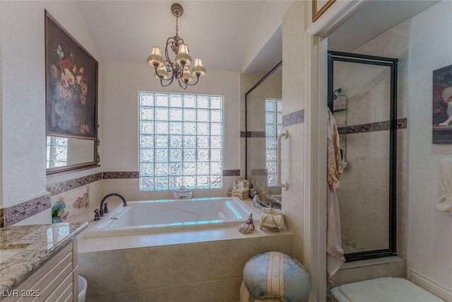 5046 Crooked Stick Way, Las Vegas, NV 89113 - full bathroom with plenty of natural light, a bath, a chandelier, and lofted ceiling