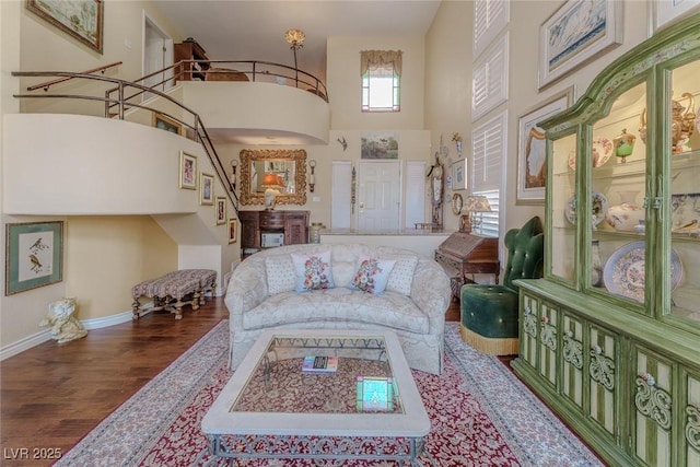 5046 Crooked Stick Way, Las Vegas, NV 89113 - living area with wood finished floors, a towering ceiling, and stairway