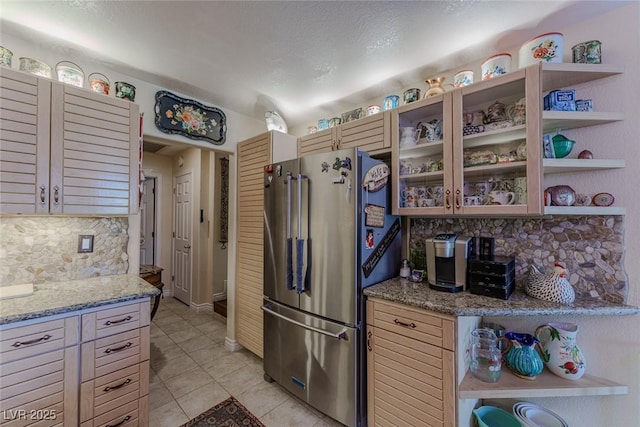 5046 Crooked Stick Way, Las Vegas, NV 89113 - kitchen featuring freestanding refrigerator, open shelves, tasteful backsplash, and light tile patterned flooring