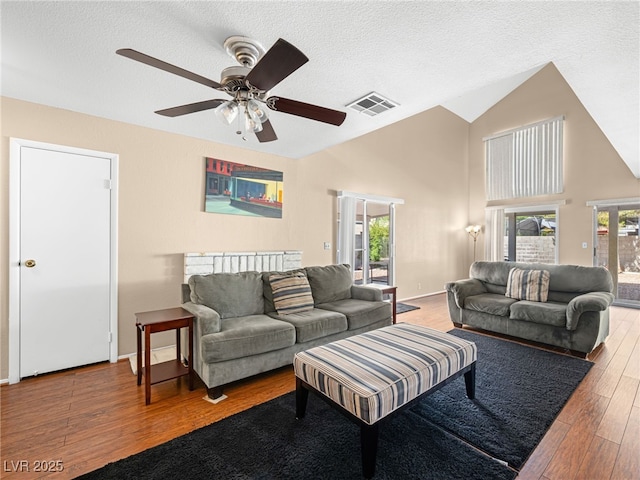 3740 Broadriver Dr, Las Vegas, NV 89108 - living area featuring a ceiling fan, wood finished floors, a textured ceiling, and high vaulted ceiling
