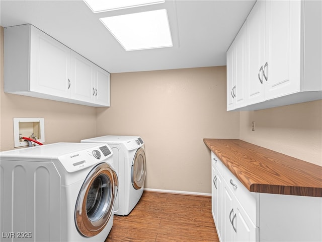 3740 Broadriver Dr, Las Vegas, NV 89108 - laundry area featuring cabinet space, independent washer and dryer, and light wood-type flooring