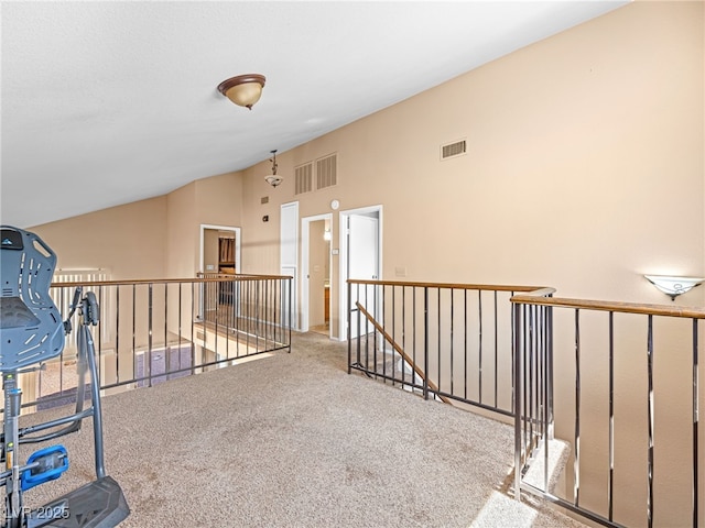 3740 Broadriver Dr, Las Vegas, NV 89108 - corridor with an upstairs landing, vaulted ceiling, and carpet floors