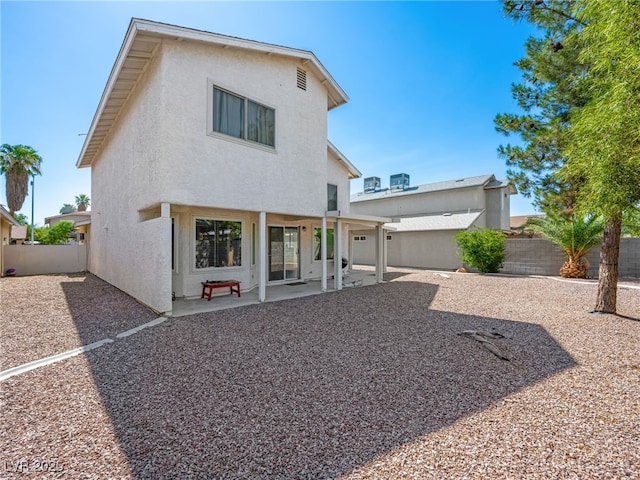 3740 Broadriver Dr, Las Vegas, NV 89108 - back of property with stucco siding, a fenced backyard, and a patio area