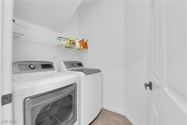 11010 Santorini Dr, Las Vegas, NV 89141 - laundry area featuring washer and clothes dryer and light tile patterned floors