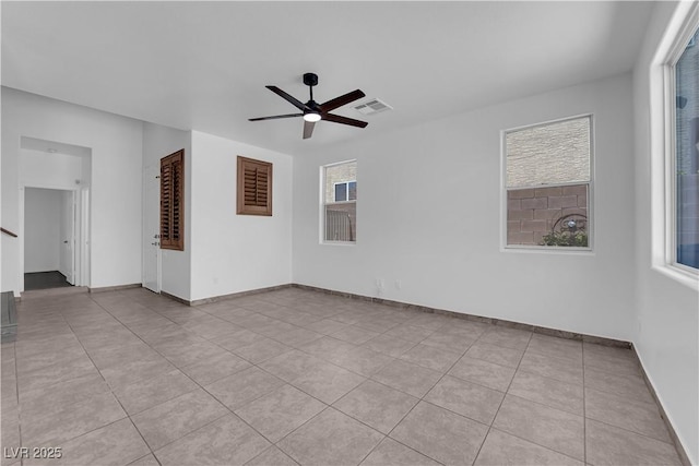 11010 Santorini Dr, Las Vegas, NV 89141 - spare room with ceiling fan, light tile patterned floors, and stairway