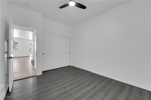 11010 Santorini Dr, Las Vegas, NV 89141 - unfurnished bedroom featuring dark wood-style flooring, a ceiling fan, and a closet