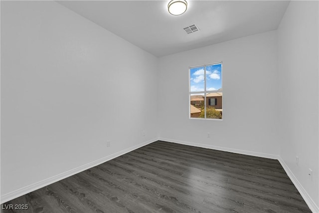11010 Santorini Dr, Las Vegas, NV 89141 - empty room featuring dark wood finished floors and baseboards