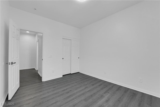 11010 Santorini Dr, Las Vegas, NV 89141 - unfurnished bedroom with dark wood-type flooring and a closet