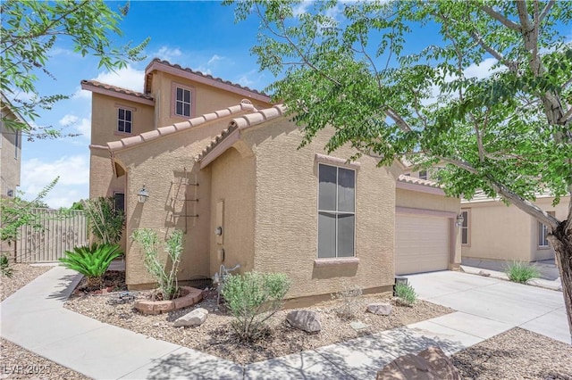 11010 Santorini Dr, Las Vegas, NV 89141 - mediterranean / spanish home with stucco siding, driveway, a tile roof, and a garage