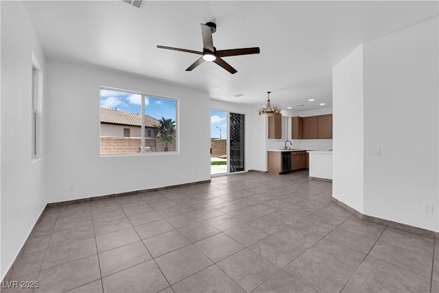 11010 Santorini Dr, Las Vegas, NV 89141 - unfurnished living room with a chandelier, a ceiling fan, tile patterned flooring, and recessed lighting