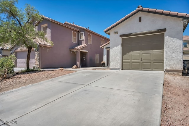 4020 Pistachio Nut Ave, Las Vegas, NV 89115 - view of front of property featuring a tiled roof, concrete driveway, and stucco siding
