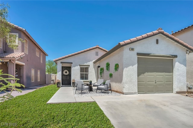 4020 Pistachio Nut Ave, Las Vegas, NV 89115 - back of house featuring a garage, stucco siding, concrete driveway, a tile roof, and a lawn