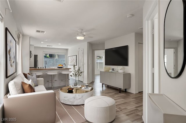 4020 Pistachio Nut Ave, Las Vegas, NV 89115 - living room featuring wood finished floors, ceiling fan, and recessed lighting